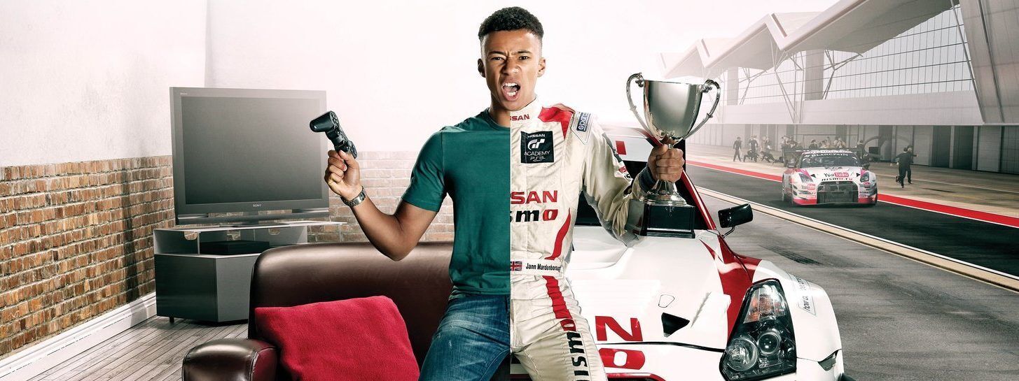 Man with image split down the middle, one side in regular attire in a lounge holding a game controller, and the other side in racing overalls holding a trophy and sat on a Nissan GT3 race car.