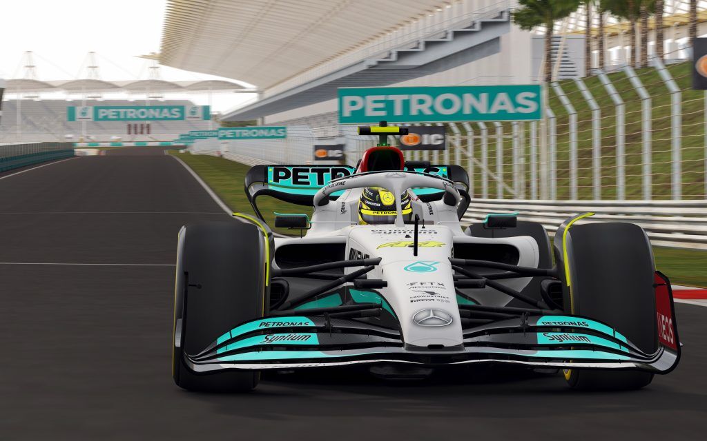 Lewis Hamilton Mercedes on the start finish straight at Sepang looking back down the straight
