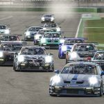 A collection of Porsche 992 GT3 Cup cars on the start finish straight line at Hockenheim.