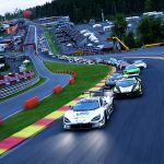 A large field of GT3 cars driving through Eau Rouge and Radillion at Spa-Francorchamps.