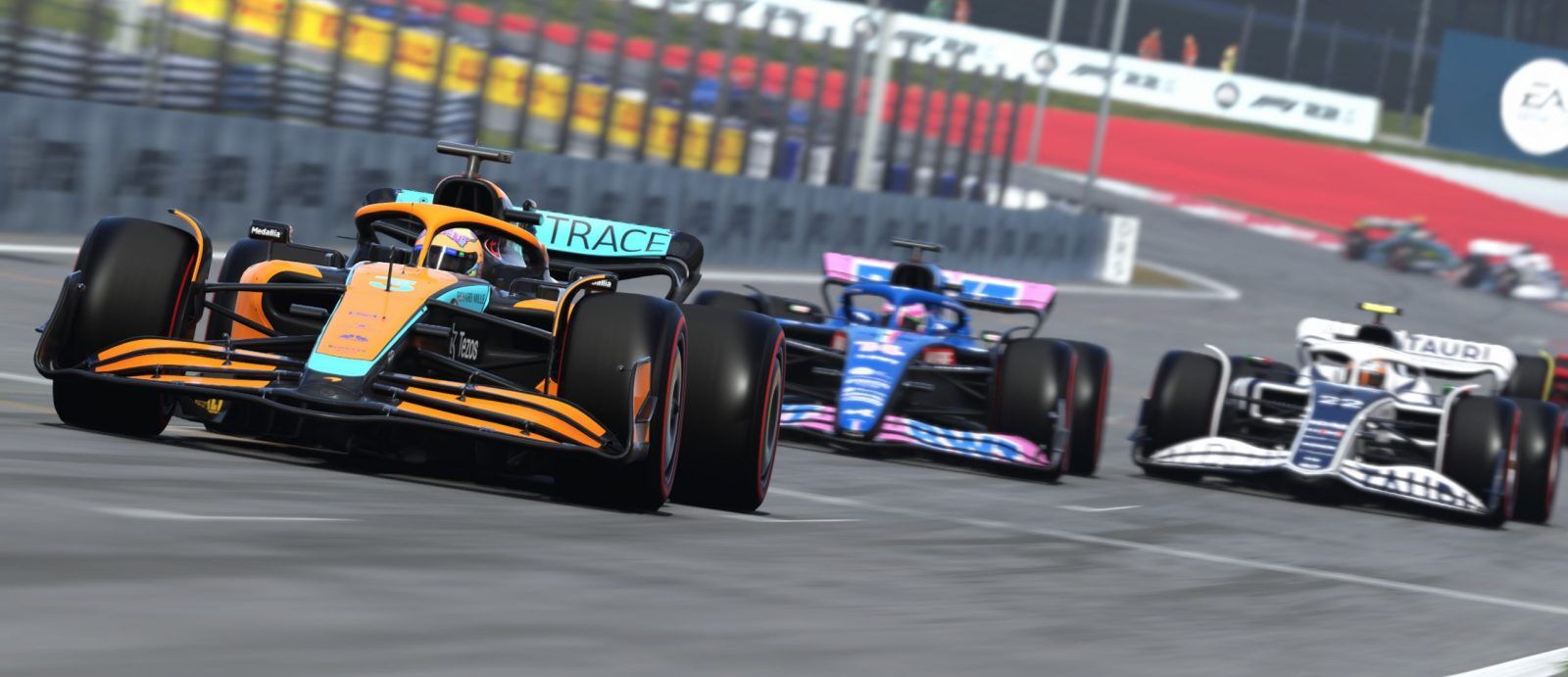 F1 22 gameplay with Daniel Ricciardo leading Fernando Alonso and Yuki Tsunoda on the Red Bull Ring's pit straight.