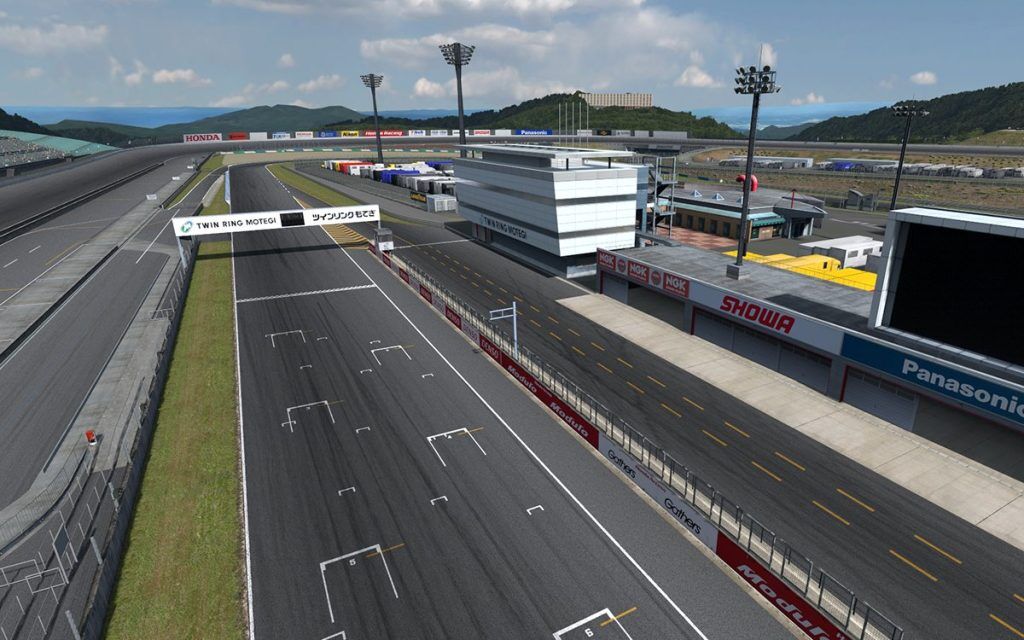 An overview of the pit straight at Motegi, with the oval track next to it.