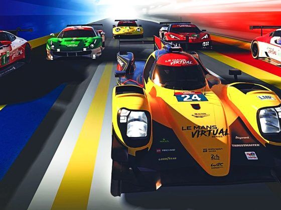 An Oreca 07 Le Mans Prototype 2 car in front of shot. Behind are a line of GTE class cars from left to right: BMW M8, Ferrari 488, Porsche 911, Corvette C8 and Aston Martin Vantage.
