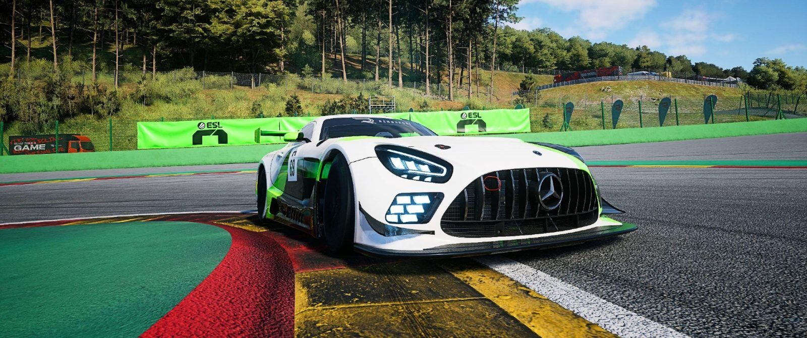 A Mercedes-AMG GT3 taking the first part of the Bus Stop chicane at Spa-Francorchamps with an ESL R1 logo behind.