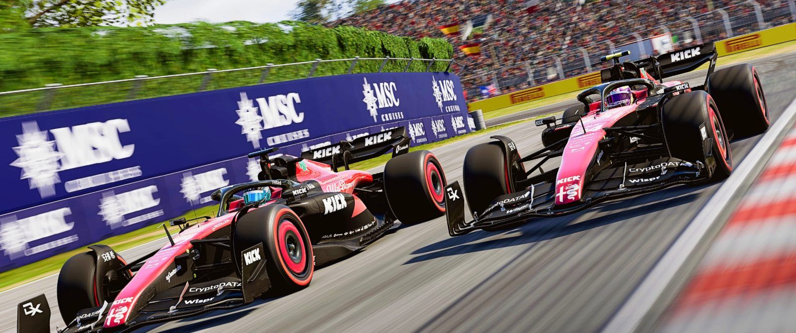 Two red and black F1 cars side by side at speed
