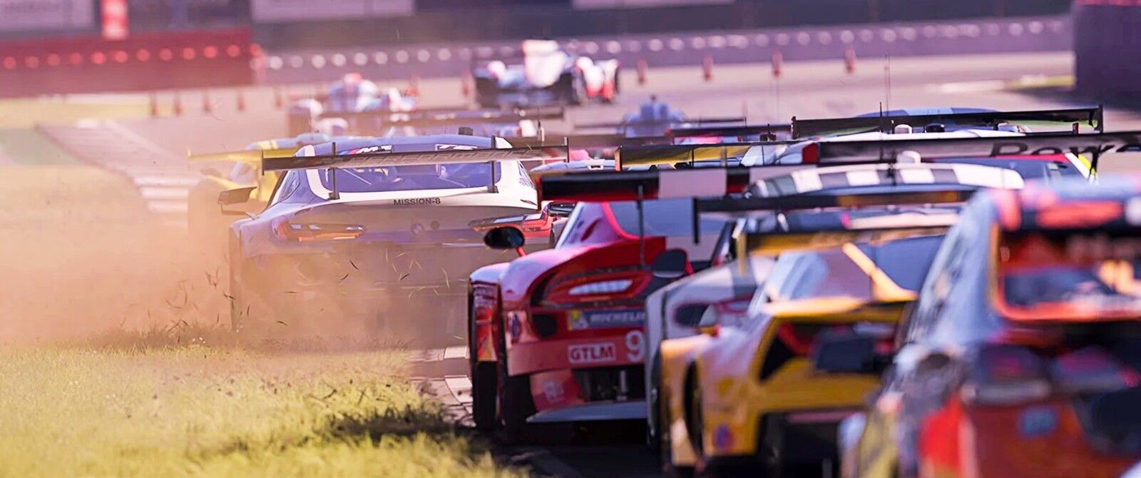 A field of racing cars bunched up with some running a tyre in the grass.