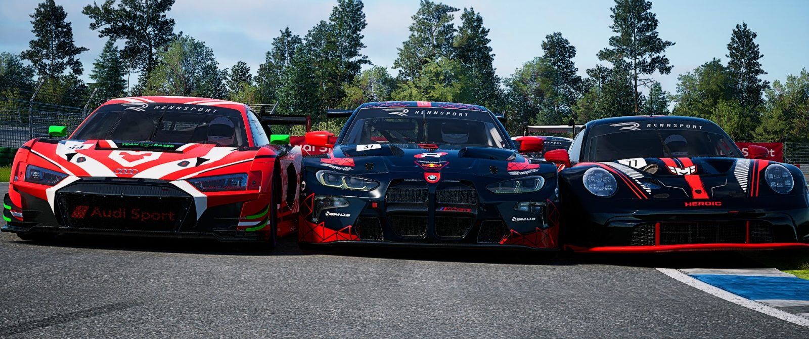 Three cars. On the left, a red and white Audi R8 GT3, in the middle, a BMW M4 GT3 in an ultra dark blue and red colour scheme, on the right a Porsche 911 GT3 in a black, white and orange livery.