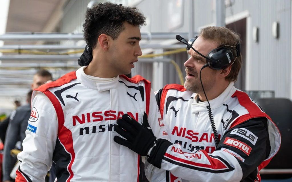 Two men in Nissan branded overalls.