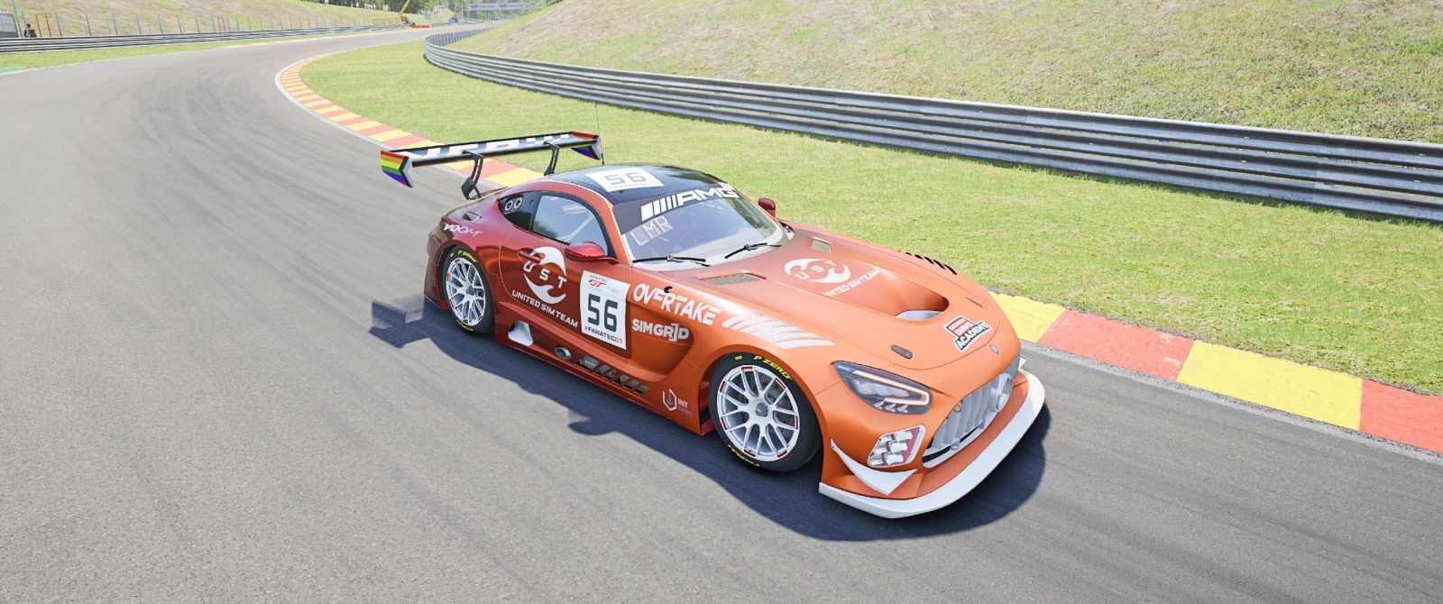 A red and orange Mercedes AMG GT3 with an OverTake logo on the front.