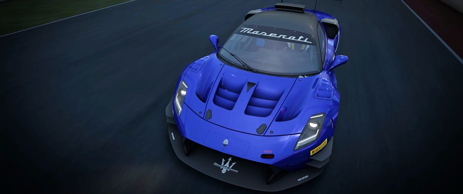 A blue racing car on a racetrack.