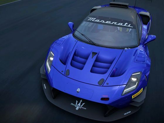 A blue racing car on a racetrack.