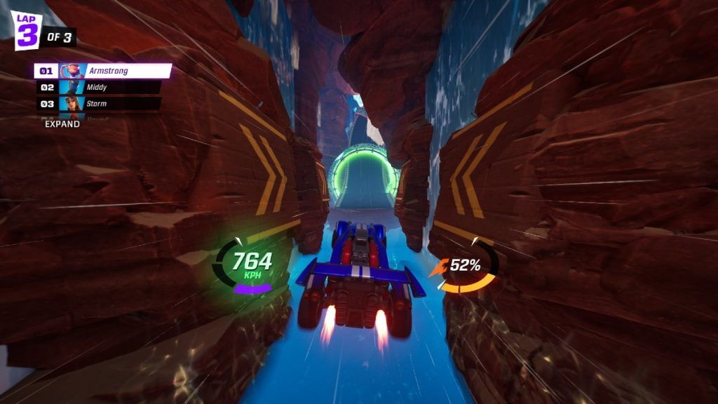 A car in mid-air between two canyons with a road ahead.