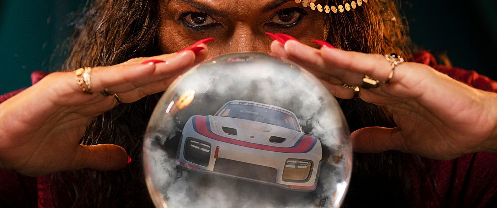 A crystal ball with a Porsche 935 sportscar in it.