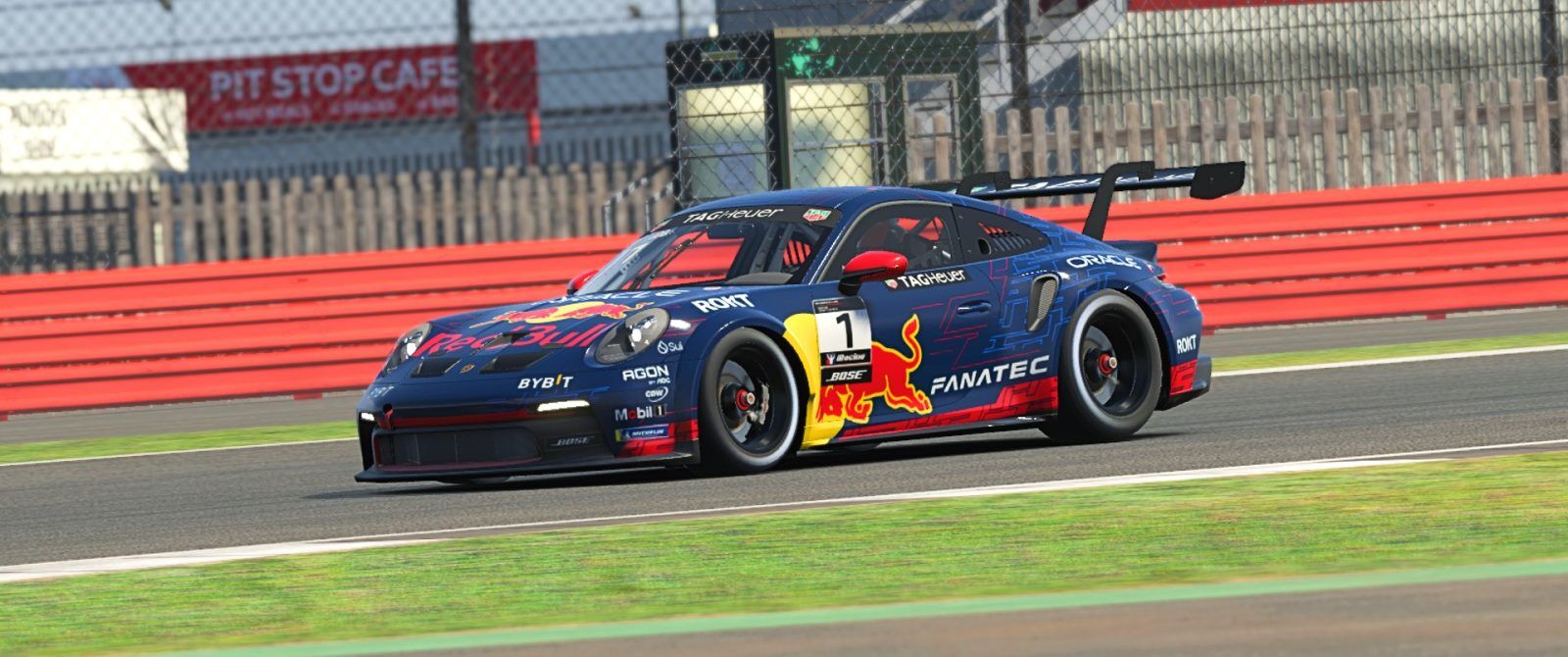 A Red Bull livery Porsche 911 racing car.