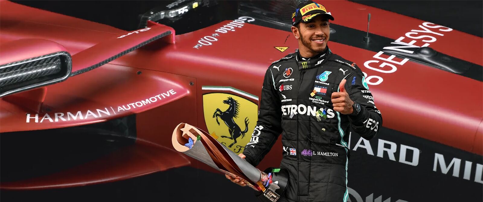 Lewis Hamilton with trophy in front of a Ferrari SF-23