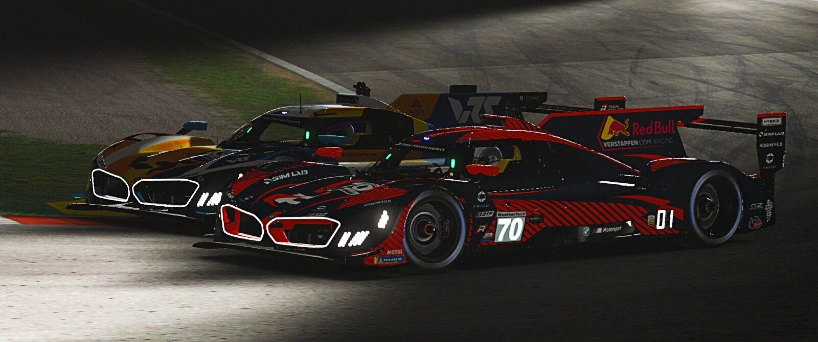 Two low slung bespoke racing cars side by side at nighttime on a racing track.